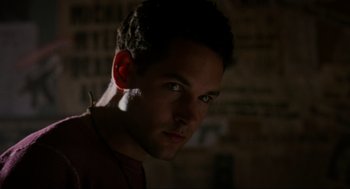 Movie still from “Halloween: The Curse of Michael Myers” (1995), directed by Joe Chappelle – A person's face in a dark room; Close Up shot, Low angle