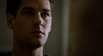 Movie still from “Halloween: The Curse of Michael Myers” (1995), directed by Joe Chappelle – A young man's face in the dark; Close Up shot, Low angle