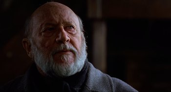 Movie still from “Halloween: The Curse of Michael Myers” (1995), directed by Joe Chappelle – An old man with a beard and a gray jacket; Close Up shot, Low angle