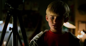 Movie still from “Halloween: The Curse of Michael Myers” (1995), directed by Joe Chappelle – A young boy is looking at the camera; Close Up shot, Low angle