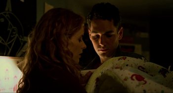 Movie still from “Halloween: The Curse of Michael Myers” (1995), directed by Joe Chappelle – A man and a woman looking at each other in the dark; Close Up shot, Low angle