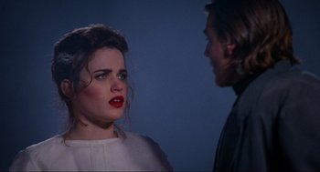 Movie still from “Halloween: The Curse of Michael Myers” (1995), directed by Joe Chappelle – A man and a woman standing next to each other; Close Up shot, Over the shoulder angle
