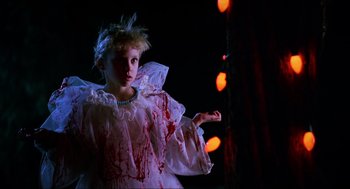 Movie still from “Halloween: The Curse of Michael Myers” (1995), directed by Joe Chappelle – A little girl dressed up as a zombie girl; Medium shot, Low angle