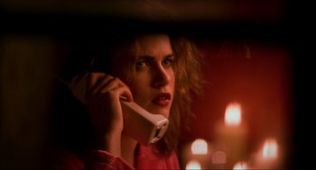 Movie still from “Halloween: The Curse of Michael Myers” (1995), directed by Joe Chappelle – A woman holding a cell phone up to her ear; Close Up shot, Low angle