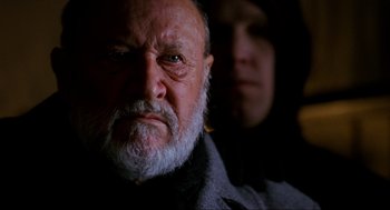 Movie still from “Halloween: The Curse of Michael Myers” (1995), directed by Joe Chappelle – An old man with a beard and a man with a white beard; Close Up shot, Low angle