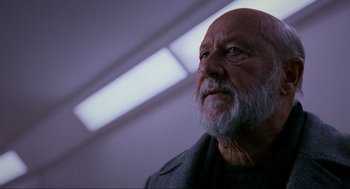 Movie still from “Halloween: The Curse of Michael Myers” (1995), directed by Joe Chappelle – An older man with a beard looking up at the ceiling; Close Up shot, Low angle
