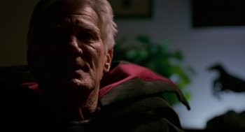 Movie still from “Halloween: The Curse of Michael Myers” (1995), directed by Joe Chappelle – An older man with white hair wearing a red jacket; Close Up shot, Low angle