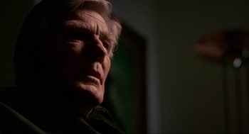 Movie still from “Halloween: The Curse of Michael Myers” (1995), directed by Joe Chappelle – An older man is looking into the distance; Close Up shot, Low angle