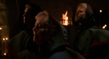 Movie still from “Halloween: The Curse of Michael Myers” (1995), directed by Joe Chappelle – A couple of people that are sitting in front of a fireplace; Close Up shot, Over the shoulder angle