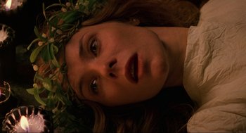 Movie still from “Halloween: The Curse of Michael Myers” (1995), directed by Joe Chappelle – A person wearing a crown; Close Up shot, Overhead angle