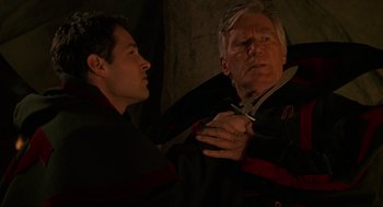 Movie still from “Halloween: The Curse of Michael Myers” (1995), directed by Joe Chappelle – A man holding a pair of scissors near another man's face; Close Up shot, Over the shoulder angle