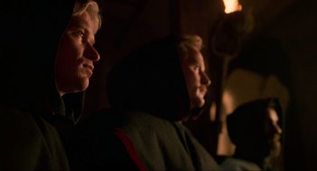 Movie still from “Halloween: The Curse of Michael Myers” (1995), directed by Joe Chappelle – Two men sitting next to each other in a dark room; Close Up shot, Low angle