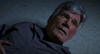 Movie still from “Halloween: The Curse of Michael Myers” (1995), directed by Joe Chappelle – An older man looking up at the ceiling; Close Up shot, Overhead angle