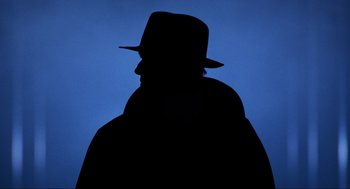 Movie still from “Halloween: The Curse of Michael Myers” (1995), directed by Joe Chappelle – A man in a hat and a black jacket; Close Up shot, Low angle