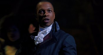 Movie still from “Hamilton” (2020), directed by Thomas Kail – A man wearing a blue jacket and a white shirt; Close Up shot, High angle