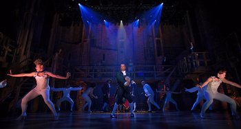 Movie still from “Hamilton” (2020), directed by Thomas Kail – A group of people in a room with lights on; Extreme Wide shot, Low angle