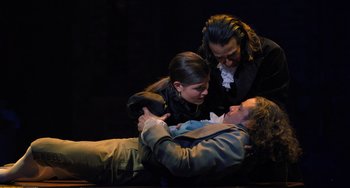 Movie still from “Hamilton” (2020), directed by Thomas Kail – A group of three people on the ground; Medium shot, High angle