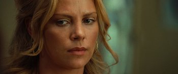 Movie still from “Hancock” (2008), directed by Peter Berg – A woman's face with blonde hair; Close Up shot, Over the shoulder angle