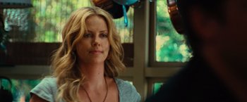 Movie still from “Hancock” (2008), directed by Peter Berg – Charlize theron in a scene from the movie a million ways to die in the west; Close Up shot, Over the shoulder angle