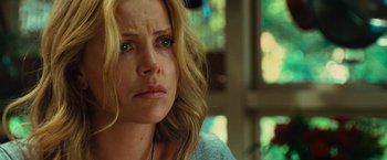 Movie still from “Hancock” (2008), directed by Peter Berg – A person with long blonde hair; Close Up shot, Over the shoulder angle