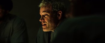 Movie still from “Hancock” (2008), directed by Peter Berg – A person looking at the camera; Close Up shot, Low angle