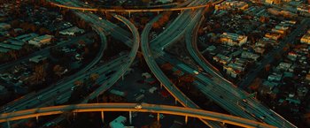 Movie still from “Hancock” (2008), directed by Peter Berg – An aerial view of an intersection in the middle of the night; Extreme Wide shot, Overhead angle