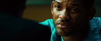 Movie still from “Hancock” (2008), directed by Peter Berg – A man's face in a blue shirt; Close Up shot, Over the shoulder angle