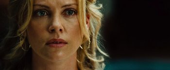 Movie still from “Hancock” (2008), directed by Peter Berg – A woman's face with blonde hair; Close Up shot, Over the shoulder angle