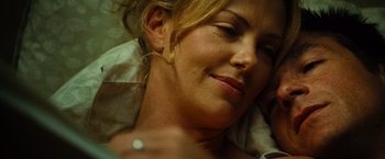 Movie still from “Hancock” (2008), directed by Peter Berg – A person laying on a bed; Close Up shot, Overhead angle