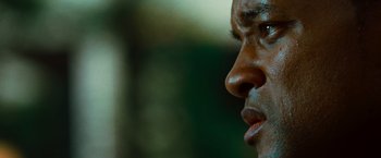 Movie still from “Hancock” (2008), directed by Peter Berg – A man's face with his eyes closed; Extreme Close Up shot, Low angle