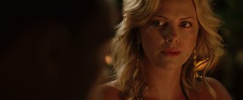 Movie still from “Hancock” (2008), directed by Peter Berg – A woman's face in the dark; Close Up shot, Over the shoulder angle