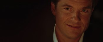 Movie still from “Hancock” (2008), directed by Peter Berg – A man's face in a dark room; Close Up shot, High angle