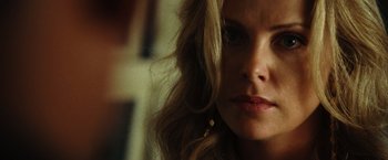Movie still from “Hancock” (2008), directed by Peter Berg – A person with long hair; Close Up shot, Over the shoulder angle
