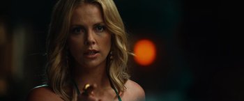 Movie still from “Hancock” (2008), directed by Peter Berg – A beautiful blonde woman holding a piece of food; Close Up shot, Over the shoulder angle