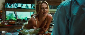 Movie still from “Hancock” (2008), directed by Peter Berg – A beautiful woman laying on the ground next to a bottle of beer; Close Up shot, Over the shoulder angle