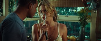 Movie still from “Hancock” (2008), directed by Peter Berg – A man and a woman holding a fork in their hands; Close Up shot, Over the shoulder angle