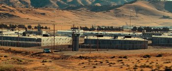 Movie still from “Hancock” (2008), directed by Peter Berg – An industrial area in the middle of the desert; Extreme Wide shot, High angle