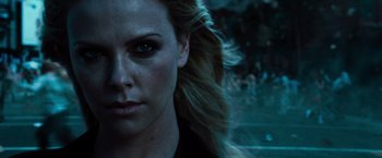 Movie still from “Hancock” (2008), directed by Peter Berg – A woman's face in a dark room; Close Up shot, Over the shoulder angle