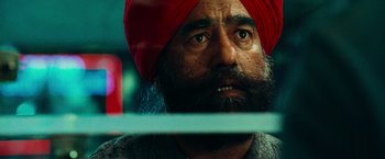 Movie still from “Hancock” (2008), directed by Peter Berg – A person wearing a turban; Close Up shot, Low angle
