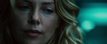 Movie still from “Hancock” (2008), directed by Peter Berg – A woman's face with blue makeup; Close Up shot, Low angle