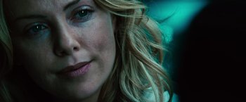 Movie still from “Hancock” (2008), directed by Peter Berg – A woman's face with long blonde hair; Close Up shot, Over the shoulder angle