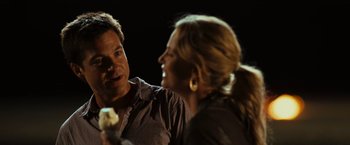 Movie still from “Hancock” (2008), directed by Peter Berg – A man and a woman are talking to each other; Close Up shot, Over the shoulder angle