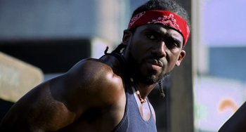 Movie still from “Hannibal” (2001), directed by Ridley Scott – A person with a bandana on; Close Up shot, Low angle