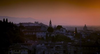 Movie still from “Hannibal” (2001), directed by Ridley Scott – A view of a city at dusk or dawn; Extreme Wide shot, Low angle