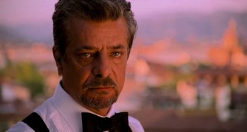 Movie still from “Hannibal” (2001), directed by Ridley Scott – A person wearing a bow tie; Close Up shot, Low angle