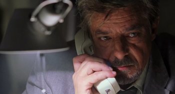 Movie still from “Hannibal” (2001), directed by Ridley Scott – A person talking on a cell phone; Close Up shot, Low angle