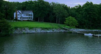 Movie still from “Hannibal” (2001), directed by Ridley Scott – A house sitting on the side of a river; Extreme Wide shot, High angle