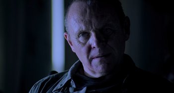 Movie still from “Hannibal” (2001), directed by Ridley Scott – A person wearing a jacket; Close Up shot, Low angle