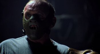 Movie still from “Hannibal” (2001), directed by Ridley Scott – A person wearing a mask; Close Up shot, Low angle