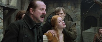 Movie still from “Hansel & Gretel: Witch Hunters” (2013), directed by Tommy Wirkola – Two men and a woman in medieval garb; Close Up shot, Low angle
